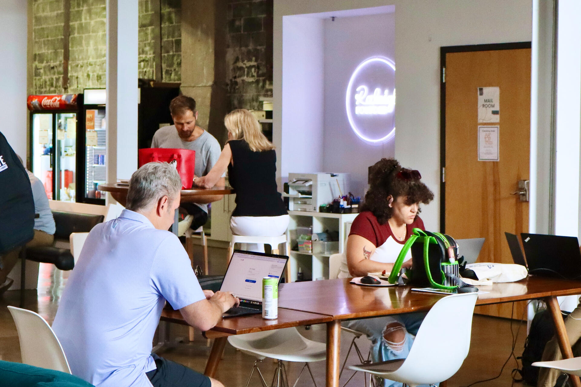 Gathering at Raleigh Founded - North Street A group of people in a coworking space